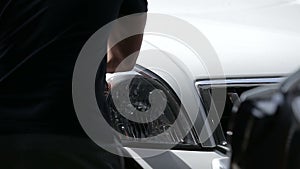 Polishing of Headlights on a white jeep