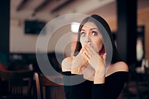 Polite Woman Covering Her Mouth at the Table