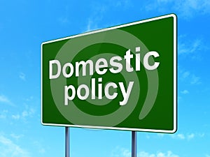 Political concept: Domestic Policy on road sign background