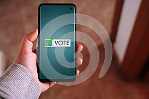 Woman use smartphone to vote online.