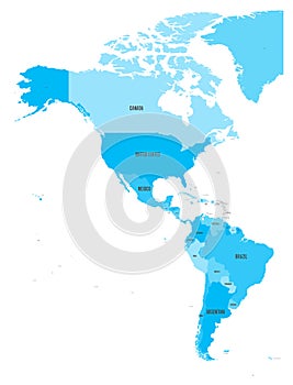 Political map of Americas in four shades of blue on white background. North and South America with country labels photo