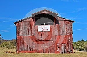 Political sign Vote on red barn