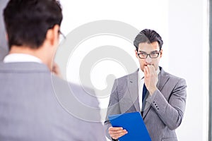 The politician planning speach in front of mirror