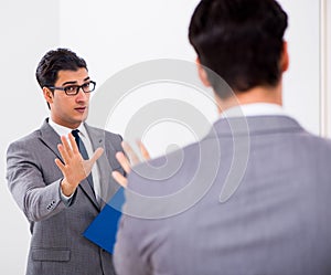 Politician planning speach in front of mirror