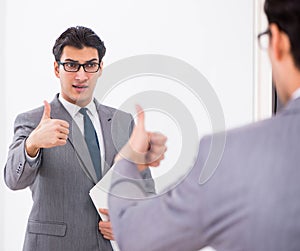 Politician planning speach in front of mirror