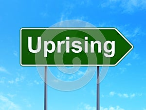 Politics concept: Uprising on road sign background