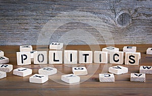 Politics from wooden letterson on wooden background