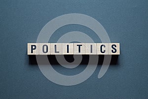 Politics - word concept on cubes