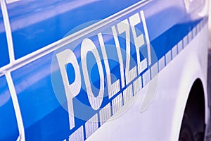 German word Polizei on a German police car photo