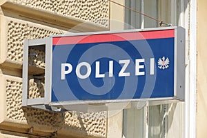 Polizei sign hanging on the facade of a Police station