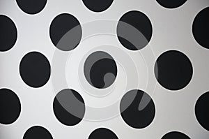 Polka dot array designs with black dots and white backdrop