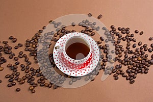 polka dot coffee cup and coffe beans