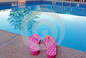 polka dot flip-flops by swimming pool