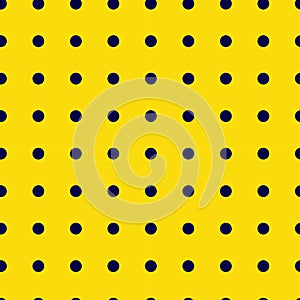 Polka dot seamless pattern. Dark blue circles on a yellow background. Vector.