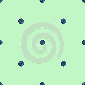 Polka dot seamless pattern. Watercolor blue circles on lightgreen background. Green texture