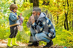 Pollen allergy concept. Father sneezing allergic reaction. Seasonal allergy. Kid boy play doctor with dad nature