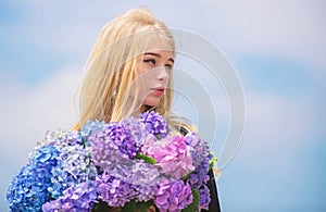 Pollen allergy. Gentle flower for delicate woman. Girl tender blonde hold hydrangea flowers bouquet. Allergy free life