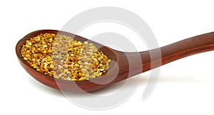 Pollen granules in wooden spoon