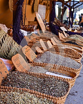 Pollensa, Mallorca, Spain - 12 Nov 2022: Dried herbs and spices on sale on a market stall in Pollensa