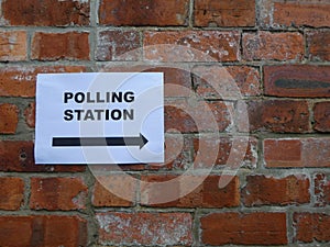 Polling Station sign on a brick wall