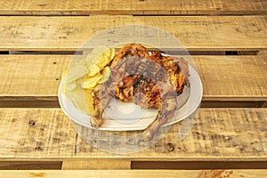 Pollo a la brasa is a generic dish made with a chicken directly exposed photo