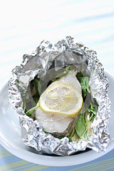 Pollock and lemon cooked in aluminium foil