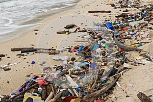 Polluted beach - plastic waste, trash and garbage closeup