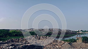 Polluted lake due to its nearby garbage area