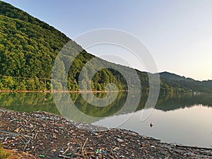 Polluted lake with plastic bottles