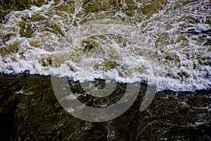 Polluted river in dark brown