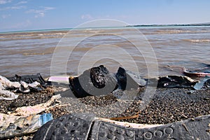 Polluted Sea Shore by Human trashes.