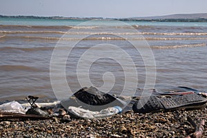 Polluted Sea Shore by Human trashes.