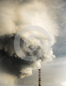 Pollution of the atmosphere. Large cloud of smoke escapes from smokestack