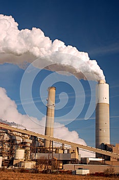 Pollution belches from a smoke stack