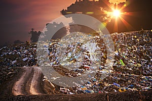 Pollution concept. Garbage pile in trash dump or landfill at twilight