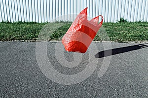 Pollution concept. Plastic bag, flying in the wind in the street.