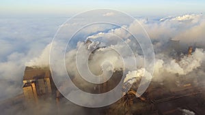 Pollution of the environment: a pipe with smoke. Industrial zone. Aerial view