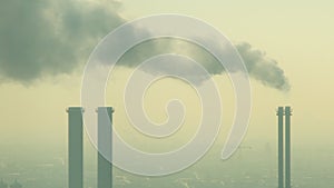 Pollution from industrial factory chimneys on the skyline of Berlin, Germany