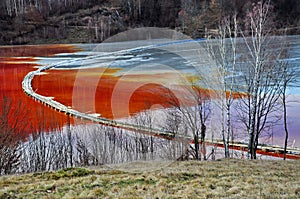 Pollution of a lake with contaminated water from a gold mine