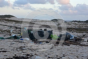 Pollution and Litter Scattered Across A Beach