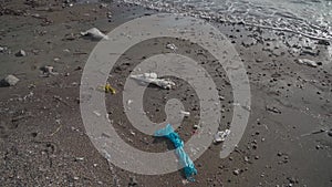 Pollution of nature, water beaches and oceans. Environmental disaster. Plastic waste pollutes beach near Mediterranean