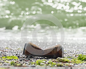 Pollution sea beach with metal waste. Aluminum can on seashore. Garbage in water of World ocean. background, copy space