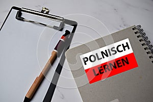 Polnisch Lernen write on a book isolated on Office Desk