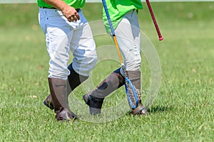 Polocrosse Players Closeup Walking Boots Rackets