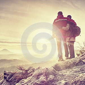 Polsko Pair of travelers on peak trail. Two photographers, a man and woman