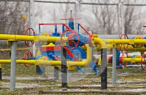 Poltava, Ukraine - February 3, 2023: Pipes, taps and a valve for shutting off gas supply at a gas compressor station