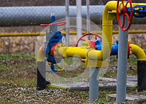 Poltava, Ukraine - February 3, 2023: Pipes, taps and a valve for shutting off gas supply at a gas compressor station