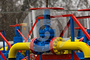 Poltava, Ukraine - February 3, 2023: Pipes, taps and a valve for shutting off gas supply at a gas compressor station