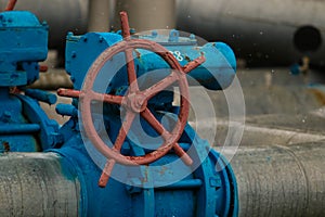 Poltava, Ukraine - February 3, 2023: Pipes, taps and a valve for shutting off gas supply at a gas compressor station