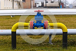 Poltava, Ukraine - February 3, 2023: Pipes, taps and a valve for shutting off gas supply at a gas compressor station